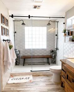 a bathroom with a shower, toilet and sink