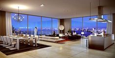 a living room filled with furniture and large windows overlooking the city at night or dawn