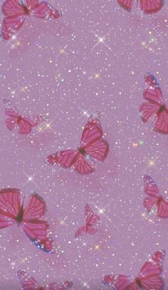 many pink butterflies flying in the sky with sparkles and stars on it's sides