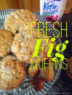 fresh fig muffins on a plate with fruit and yogurt