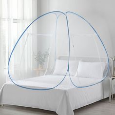 a white bed with blue trim around it