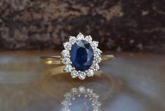 an oval shaped blue sapphire and diamond ring