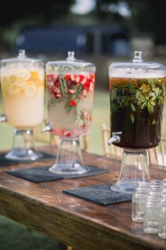 three different types of drinks on a table