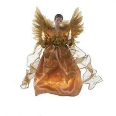 an angel figurine sitting on top of a bag filled with bread and candles