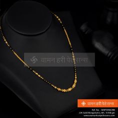 A very typical and traditional design. Black Beads Mangalsutra Design Indian, Mini Ganthan Design Gold, Mini Mangalsutra Designs Gold, Gold Chain With Black Beads, Mangalsutra Design