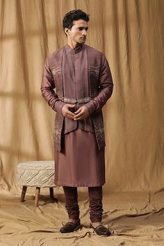 Purple kurta with embroidered panels, belted details and cuffed sleeves. Paired with a churidar. - Aza Fashions Eid Designer Wear Kurta With Woven Motifs, Fitted Kurta With Woven Motifs For Transitional Season, Designer Embroidered Traditional Wear For Ceremonies, Fitted Traditional Wear With Woven Motifs For Eid, Festive Fitted Sets With Woven Motifs, Designer Kurta With Intricate Embroidery For Traditional Ceremonies, Designer Embroidered Kurta For Traditional Ceremonies, Festive Ceremonial Kurta With Woven Motifs, Festive Sets With Woven Motifs And Traditional Drape