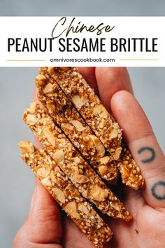 a person holding up some kind of granola bar in their hand with the words chinese peanut sesame brittle on it