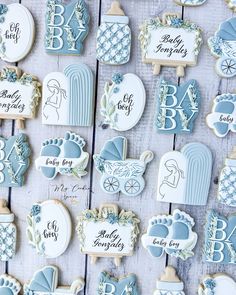 baby shower cookies are arranged on a table