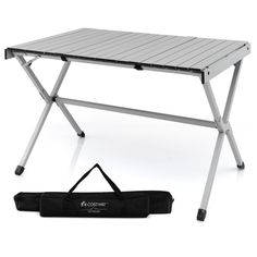 a folding table with a black bag next to it