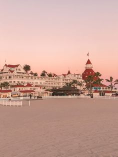 the beach is lined with hotels and palm trees