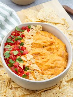 a white bowl filled with salsa and tortilla chips