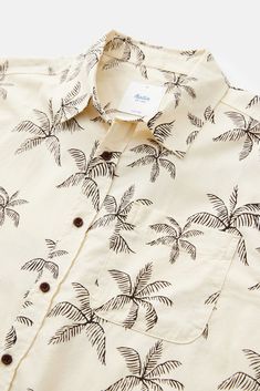 The Mai Tai Shirt features a custom palm print atop a breathable cotton/linen button-up woven shirt. 60% cotton / 40% viscose blend Allover palm print Pocket at left chest Garment washed Clean-finished interior Model is 5'4, 110lbs and wears a size L White Tropical Camp Shirt With Palm Tree Print, Vacation Button-up Shirt With Palm Tree Print, White Tropical Shirt With Palm Tree Print, Palm Tree Print Button-up Shirt For Vacation, White Cotton Tropical Camp Shirt, Vacation Palm Tree Print Button-up Shirt, White Tropical Cotton Camp Shirt, White Tropical Cotton Shirt, White Cotton Hawaiian Shirt With Tropical Print