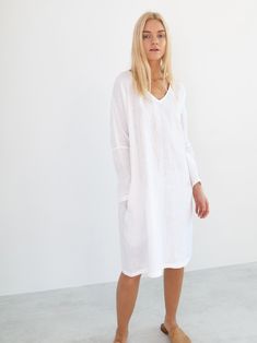 "FRIDA is a long sleeve linen dress with belt. DETAILS - Long sleeves - V neckline - Relaxed fit - Knee length - Self tie belt - Side seam pockets - 100% lightweight European linen fabric - Cut and sewn to order just for you in our studio COLOR - White, you can also choose other colors above - Fabric samples are available here https://www.etsy.com/listing/586569696/linen-fabric-samples SIZING & FIT - Relaxed fit - Length is approximately 38.5 inches / 98 cm - Bust is approximately 21 inches V-neck Linen Dress For Workwear With Relaxed Fit, Relaxed Fit Linen V-neck Dress For Work, Summer V-neck Long Sleeve Dress For Daywear, V-neck Linen Dress For Brunch, White Long Sleeve Linen Dress For Spring, Relaxed Fit V-neck Linen Dress For Work, White Long Sleeve Summer Dress For Daywear, White Long Sleeve Dress For Summer Daywear, Casual Linen V-neck Dress For Brunch