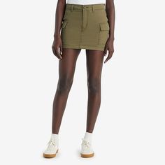 Your favorite cargo-in skirt form. With an ultra-flattering mid-rise and an above-the-knee length cut, our mini cargo skirt features oversized patch pockets and an effortless '90s style.Front Style: Flat FrontFeatures: Fly FrontClosure Type: Button, ZipperClosure Location: FrontPockets: 2 Cargo Side PocketsRise: Mid RiseApparel Length: 13 InchesFiber Content: 100% CottonLining: UnlinedSkirt Length: Short LengthCare: Machine Wash, Tumble DrySkirt Type: Denim SkirtsCountry of Origin: Imported Spring Mid-rise Cargo Skirt, High Rise Utility Cargo Shorts For Spring, Casual High Waist Skort With Cargo Pockets, Fitted Denim Skirt With Cargo Pockets For Spring, High Rise Fitted Cargo Skirt With Pockets, Mid-rise Utility Cargo Shorts For Spring, High-rise Fitted Cargo Skirt With Pockets, Fitted High Rise Cotton Cargo Skirt, High Rise Cargo Shorts For Spring