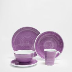 purple dinnerware set with matching saucers and cups