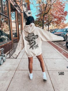 Saddle up in style with our "Cowboy Killer" Hooded Sweatshirt, featuring a rugged skull donning a classic cowboy hat. This Western-inspired hoodie blends frontier flair with urban edge, perfect for those who embrace the spirit of the wild west. Let your inner cowboy shine in this bold and fearless statement piece. Production Time: 1-5 days Shipping Time: 2-5 days Description: Gildan 18500 Unisex Hooded Sweatshirt Medium-heavy fabric Loose fit Runs true to size 50% cotton, 50% polyester Sewn-in l Sorority Sweatshirts, V Neck Shirts, Dance Mom, Christian Sweatshirt, Sorority Gifts, Greek Life, Look Plus, Hoodie Design, Cold Day