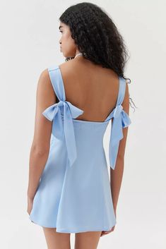 UO Bri Double Bow Satin Mini Dress | Urban Outfitters Cocktail A-line Mini Dress With Bow, Spring A-line Mini Dress With Bow Straps, Chic Mini Dress With Sweetheart Neckline And Tie Back, Feminine Bow Tie Backless Mini Dress, A-line Mini Dress With Bow Straps For Evening, Sweetheart Neckline Mini Dress With Tie Back, Elegant Mini Dress With Bow Tie Back For Bridesmaid, Mini Dress With Tie Straps For Brunch, Feminine Tie Back Mini Dress For Bridesmaid