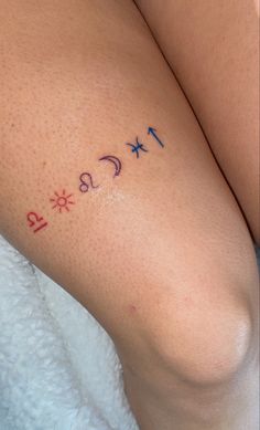 a close up of a person's legs with numbers tattooed on the leg area