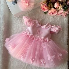 custom handmade dresses for your baby. Made with tulle. It is prepared with a soft cotton lining. It has a zipper on the back, very easy and comfortable to wear. 👉🏻 you can leave a message for more questions 👉🏻 It is a handmade dress that you can measure and customize. Very dense tulle layers are used, very fluffy, personalized color options are available, you can customize ✈️Express within 3-5 days to most countries💝 Cute Floral Applique Dress For Birthday, Birthday Dress With Floral Applique In Tulle, Pink Fitted Princess Dress With Floral Applique, Cute Pink Tulle Baptism Dress, Pink Floral Applique Dress For Birthday, Pink Birthday Dresses With Floral Applique, Pink Dresses With Floral Applique For Birthday, Cute Pink Dresses With Floral Applique, Cute Pink Dress With Floral Applique