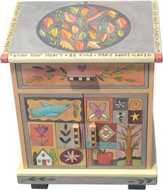 a wooden box with many different designs on it