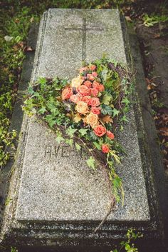 flowers are placed on the headstone of a grave