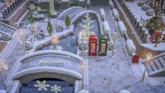 an animated city with lots of snow on the ground and christmas decorations in front of it