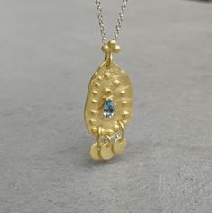 Solid gold necklace with blue topaz stone 9K Gold December birthstone, Boho gold necklace, Yellow gold necklace, Gift for her This solid gold necklace has a rustic textured and is set with a natural blue topaz. The pendant has a delicate granulation all around it. This pendant is delicate but has a lot of character, and will upgrade any outfit you'll wear, for everyday use, as for special occasions The pendant can be ordered without the chain too. An excellent choice for anniversary gift or birt Blue Topaz Oval Pendant Necklace With Birthstone, Blue Topaz Birthstone Necklace With Oval Pendant, Gold Blue Topaz Teardrop Pendant, Gold Necklace With Blue Topaz Birthstone, Gold Topaz Birthstone Necklace, Yellow Gold Necklace With Blue Topaz Birthstone, Gold Blue Topaz Birthstone Necklace, Gold Hallmarked Pendant Birthstone Necklace, Gold Hallmarked Birthstone Pendant Necklace