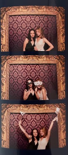 two women posing in front of a photo booth