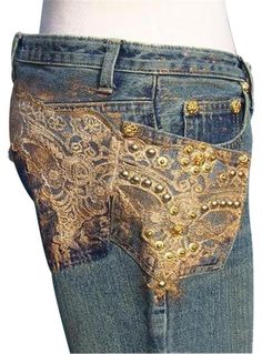 the back of a woman's jeans with gold sequins and beads on it