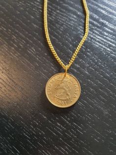 A very nice necklace for every occasion. It is sent in a fine jewelry bag. More in my shop: https://www.etsy.com/de/shop/CoinCraftShop Elegant Coin Necklace With Lobster Clasp, Elegant Coin Necklace With Lobster Clasp For Gift, Yellow Gold Coin Chain Necklace Gift, Yellow Gold Coin Chain Necklace As Gift, Vintage Coin Pendant Chain Necklace As Gift, Handmade Coin-shaped Yellow Gold Necklace, Anniversary Coin Necklace Nickel Free, Vintage Coin Necklaces As Gift, Vintage Coin Pendant Jewelry For Everyday