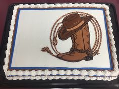 a cake with a cowboy hat and boots on it