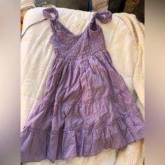 Purple Summer Dress. Size Medium. Never Worn And In Perfect Condition Cheap Sleeveless Sundress By Urban Outfitters, Purple Casual Sundress For Spring, Casual Purple Sundress For Spring, Purple Summer Sundress For Brunch, Urban Outfitters Spring Midi Dress With Ruffles, Urban Outfitters Midi Dress With Ruffles, Casual Purple Sundress For Daywear, Casual Purple Sundress For Day Out, Casual Cotton Sundress By Urban Outfitters