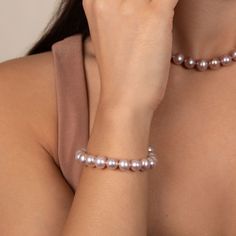 This lovely bracelet is composed of 8.5-9.0 mm lavender freshwater pearls - one of our most popular sizes. These fine pearls exhibit brilliant, rich overtones, with smooth, lustrous surfaces. The AA+ quality pearls boast varying hues of lavender complemented throughout the bracelet. The lavender colors are 100% and only found in this type of pearl. The pearls are individually hand-knotted on color-matching silk thread so that no two pearls ever rub against each other, and if the bracelet ever sn Elegant Pink Hypoallergenic Bracelet, Elegant Pink Pearl Bracelet, Elegant Purple Pearl Bracelet With Round Beads, Pearl Types, Lavender Color, Silk Thread, Body Colour, Pearl Size, Pricing Jewelry