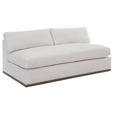 a white couch sitting on top of a wooden floor