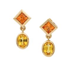 These Women's Madeira Citrine Yellow Sapphire Dangle Earrings In 18k Gold Are Stunning And Elegant. Each Earring Features Two Beautiful Bezel-Set Gemstones, A Princess-Cut Madeira Citrine, And An Oval-Cut Yellow Sapphire That Hangs And Dangles, Creating An Attractive And Eye-Catching Design. These Earrings Have A Warm Gold Tone That Complements The Colors Of The Gemstones. The Gold Is Not Rose But Has A Subtle Warm Hue That Adds To The Overall Beauty Of The Earrings. The Push-Backs Provide A Sec Yellow 14k Gold Fine Jewelry Earrings, Yellow 14k Gold Fine Earrings, Luxury Yellow Gemstone Earrings, Luxury Yellow Dangle Earrings, Gold Dangle Earrings, I Love Jewelry, Gold Earrings Dangle, Yellow Sapphire, Nice Things