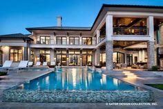 a large house with a pool in front of it