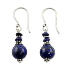 Narayani highlights the unique beauty of lapis lazuli the September??s birthstone in the design of these earrings. Lapis is said to open all the chakra centers as long as there is love in the heart comprehension in the mind and wisdom in the soul. The earrings are crafted by hand with sterling silver. .925 Sterling silver Elegant Lapis Lazuli Jewelry For Healing, Adjustable Lapis Lazuli Earrings As Gift, Adjustable Lapis Lazuli Earrings For Gift, Blue Lapis Lazuli Drop Earrings, Handmade Round Lapis Lazuli Earrings, Blue Spiritual Nickel-free Earrings, Blue Lapis Lazuli Earrings, Bohemian Lapis Lazuli Earrings, Round Lapis Lazuli Gemstone Earrings