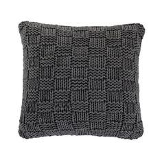 a gray knitted pillow on a white background