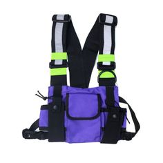 a purple and black bag with neon green straps on the front, sitting against a white background