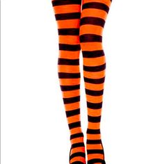 Complete Your Halloween Looks With These Cute New, Orange And Black Stripes Footed Tights. Striped Pattern Slip-On Silhouette 62% Nylon/27% Polyester/11% Spandex Machine Washable S/M Height 4’10”-5’4” 90-130 Lbs. M/L Height 5’5”-5’11” 110-170 Lbs. L/Xl Height 5’6”-6’ 130-210 Lbs. Fitted Black Hosiery For Costume Party, Stretch Hosiery For Halloween Costume Party, Thigh High Black Legwear For Halloween, Stretch Legwear For Halloween, Halloween Thigh High Legwear For Costume Party, Fitted Legwear For Halloween Cosplay, Stretch Thigh High Hosiery For Halloween, Fitted Hosiery For Halloween Costume Party, Tight Black Legwear For Halloween