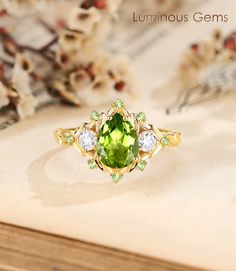 𝐌𝐚𝐢𝐧 𝐒𝐭𝐨𝐧𝐞 𝐒𝐩𝐞𝐜: 💎 Stone: Peridot 💎 Carat: 1.50ct 💎 Size of Main Stone: 6mm * 8mm 💎 Cut: Pear cut 𝐒𝐢𝐝𝐞 𝐒𝐭𝐨𝐧𝐞𝐬 𝐒𝐩𝐞𝐜: 💎 Stone: Moissanite & Peridot 💎 Carat: 0.20ct 🎨 Materials Available: ＊ 925 Sterling Silver ＊ 925 Sterling Silver (Electroplated) ＊ 10K Gold ＊ 14K Gold ＊ 18K Gold ＊ Platinum 📝 Reach out to me directly to personalize your ring size or gemstone--customization services are available upon request 📦 Package: Each ring is meticulously set in an elegantly designed gift box, ensuring a luxurious unboxing experience for those special moments Luxury Peridot Birthstone Ring With Accent Stones, Wedding Jewelry With Peridot In Halo Setting, Lime Green Peridot Jewelry For Wedding, Elegant Peridot Emerald Promise Ring, Green Pear-shaped Diamond Ring For May Birthstone, Green Moissanite Rings For Gifts, Lime Green Gemstone Wedding Jewelry, Green Peridot Jewelry For Wedding, Lime Green Gemstone Jewelry For Wedding