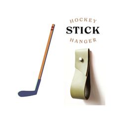 a hockey stick hanging on the side of a wall next to a leather case with an ice hockey stick sticking out of it