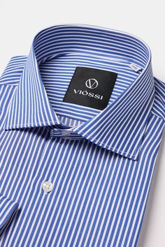 Color: blue striped Italian spread collar Material: 80% cotton, 20% polyester Fitting: slim-fit Care instructions: dry clean only Classic Blue Dress Shirt With Striped Collar, Blue Slim Fit Shirt With Fold Down Collar, Luxury Men's Shirt With Vertical Stripes, Luxury Striped Men's Shirt, Blue Polo T-shirt With Striped Collar, Mens Shirt Dress, Shirt Sale, Collar Shirts, Retro Fashion