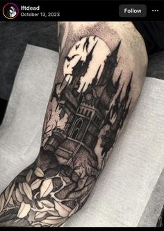 a man's arm with a castle tattoo on it