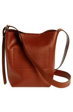 Madewell's newest leather bag collection is cool, modern and quietly luxe. With a magnetic closure and interior pocket, the mini bucket tote is perfectly sized to hold your phone, wallet, keys and more—plus, it has a shoulder strap and adjustable crossbody strap. It's so good, it's essential. Structured silhouette with flat base for stability Leather Imported Mini Bucket Bag, Bucket Tote, Mini Bucket Bags, Mini Bucket, Bag Collection, Phone Wallet, Crossbody Strap, Magnetic Closure, Bucket Bag