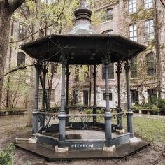 an old gazebo in the middle of a park