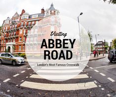 an intersection with cars and people walking on the sidewalk in front of buildings that read visiting abbey road london's most famous crosswalk