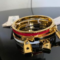 New With Tag Kate Spade New York Padlock Charm Bangle Bracelet In Red Color Price Shown For One Bracelet. Please Choose Color At Checkout. From The Lock & Spade Collection. Centered By An Embellished Lock Charm, This Hinged Enamel Bangle Bracelet Has A Refined Look. A Solitary Padlock Charm Adds Kate Spade New York Style To This Color-Accented Bangle Bracelet. Set In Gold-Tone Or Rose Gold-Tone Mixed Metal; Enamel Approx. Diameter: 2-1/2" Hinge Closure Pairs With Other Pieces From The Lock And S Red Enamel Bangle, Black Leather Cuff Bracelet, Filigree Bracelet, Faux Pearl Bracelet, Bangle Bracelet Set, Enamel Bangle, Alex And Ani Bracelets, Cuff Bangle Bracelet, Bangles Style