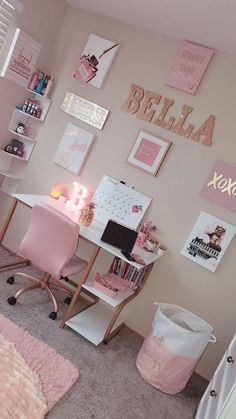 a room with pink furniture and pictures on the wall, including a desk and chair