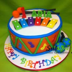 a birthday cake with musical instruments on it